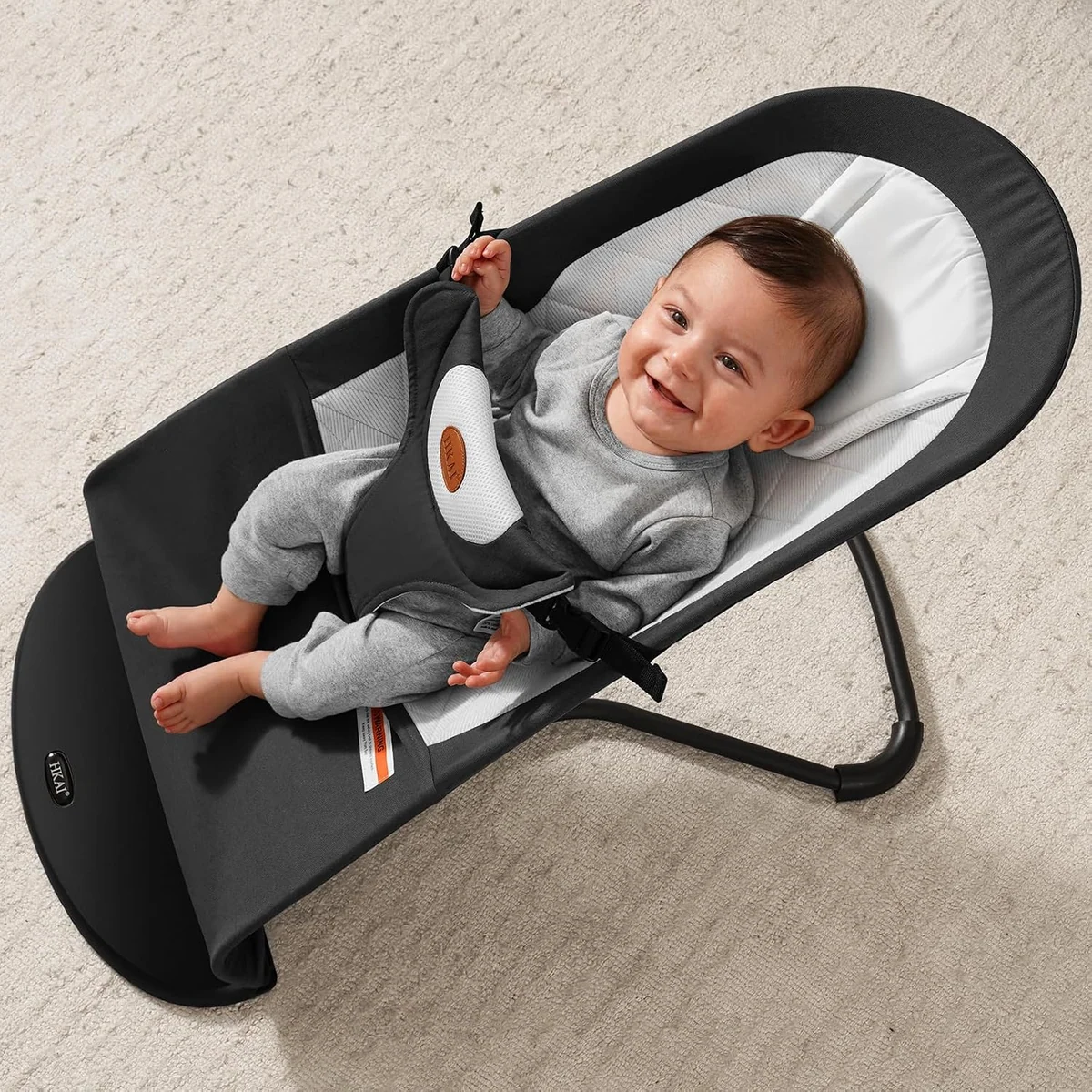 A baby in the Bouncer Seat by HKAI
